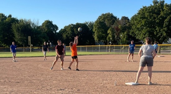 employees playing kickball