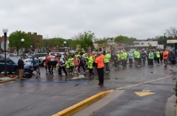 People in parking lot running together