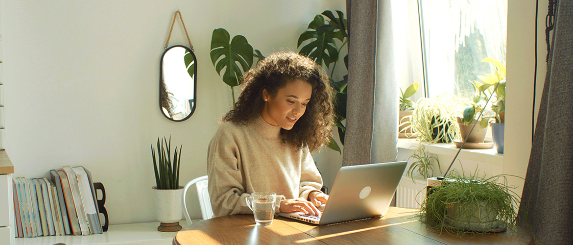 Woman working on laptop in home office
