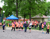Group mixing outside near tents at race location