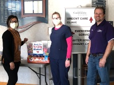 Individuals smiling with nurse at clinic