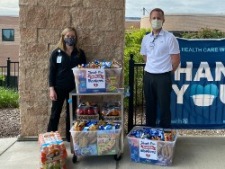2 Citizens Bank Minnesota workers helping at food drive