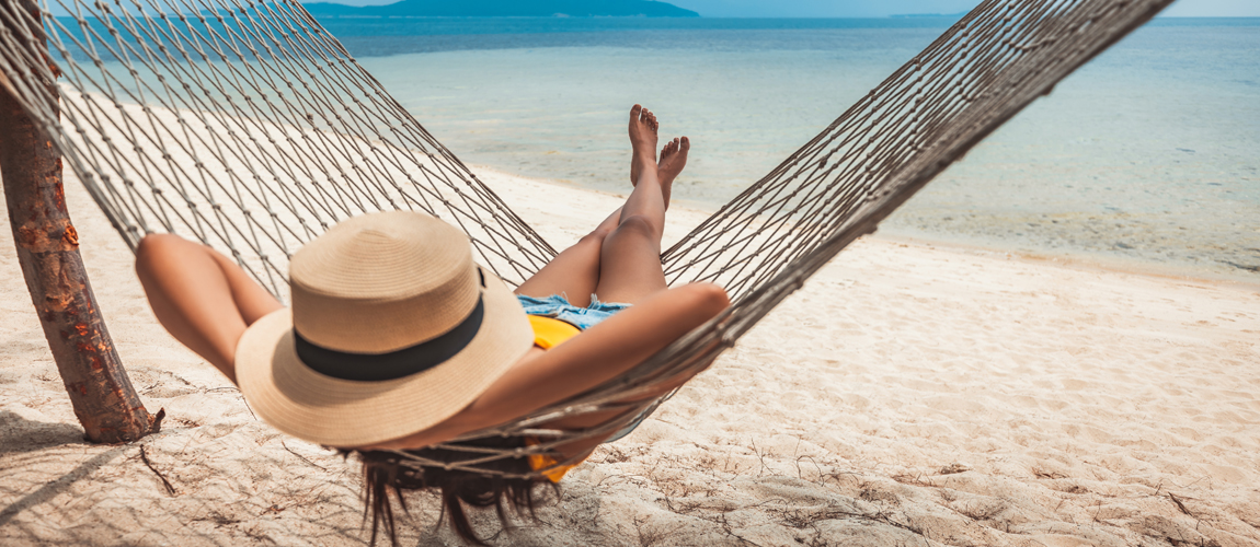 Woman in hammock on beach