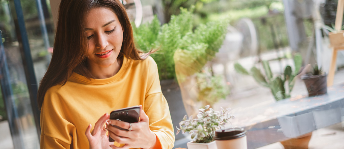 young woman using her phone for mobile banking