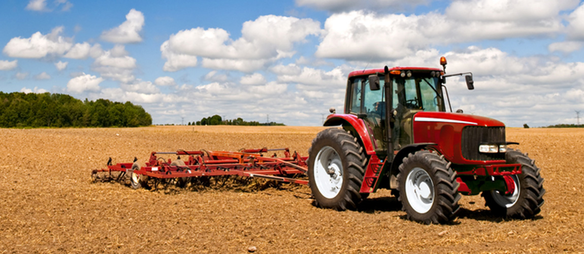 Tractor and plow in a field