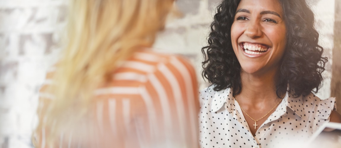 Woman smiling while talking to Customer Representative