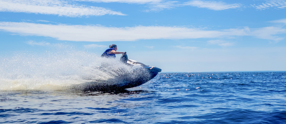 person jet skiing on a lake